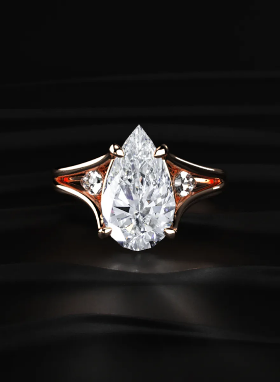 pear three stone ring
