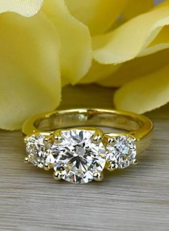 three stone yellow ring